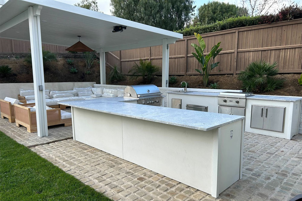 Outdoor kitchen with grill, sink, and counters, one of our Camarillo exterior renovation projects.