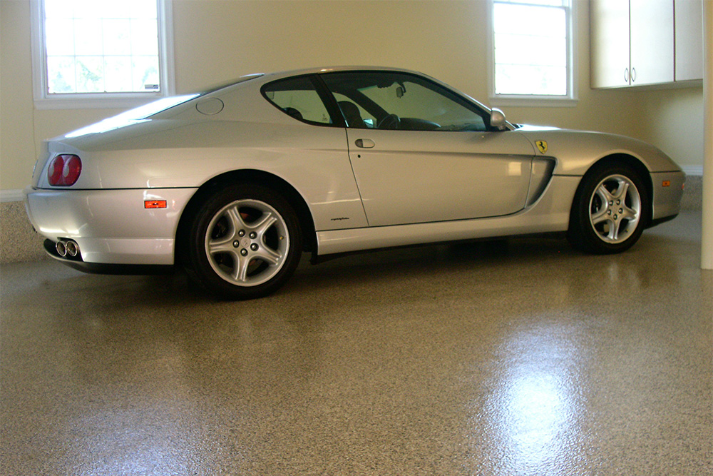 Porsche vehicle sitting on some of our Simi Valley concrete stain and sealer work.