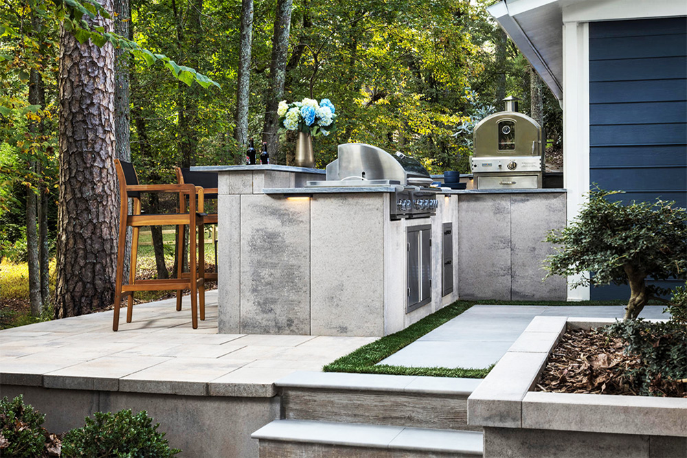 Grill, oven, and seating set up outside as part of our Moorpark outdoor kitchen renovation services.